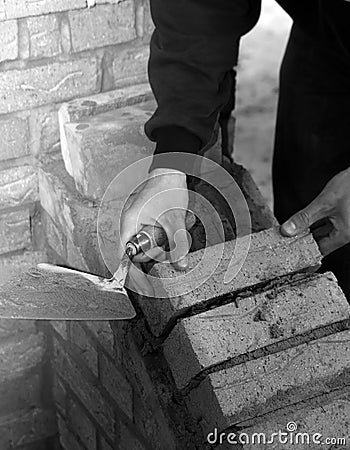 Trainee bricklayer at work Stock Photo