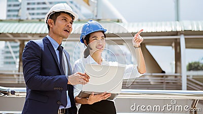 Trainee engineer present the idea to her boss Stock Photo