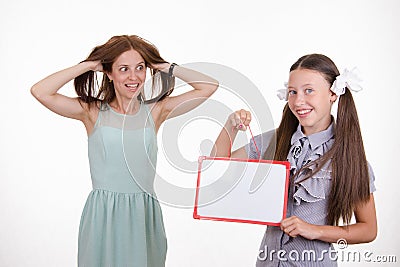 Trainee with a sign mocks pupil Stock Photo