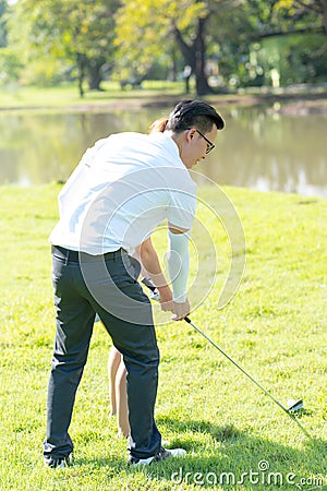 Trainer golf tutor practice for new golf player Stock Photo