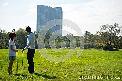 Trainer golf tutor practice for new golf player Stock Photo