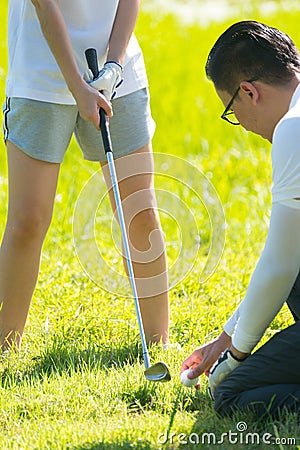 Trainer golf tutor practice for new golf player Stock Photo