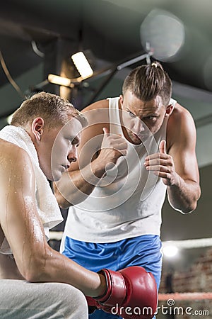 Trainer motivating boxer Stock Photo