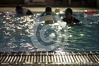 trainer practive child to swim. Blurred abstract Stock Photo