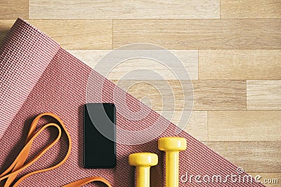 Training, doing fitness at home in lockdown with phone app. fitness accessories, mobile phone, yoga mat, Stock Photo