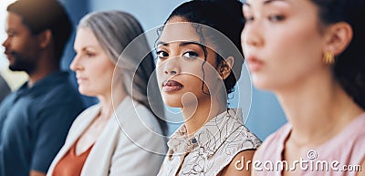 Training, learning and education with a business woman looking serious and sitting in a conference or workshop for Stock Photo