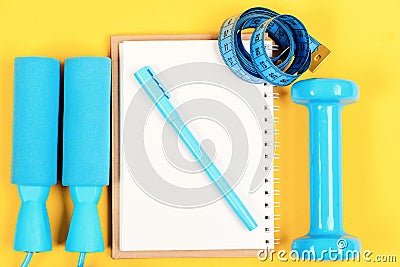 Training and refreshment concept. Notepad, pen and gym equipment Stock Photo