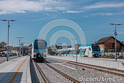 Trains arriving on station Domzale, Slovenia, after renovation. Railway track change and creation of new railway platforms was at Stock Photo