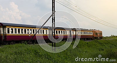 Trains blur on the grass. Stock Photo