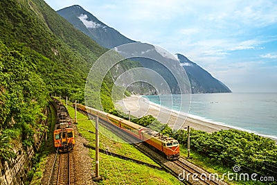 Trains at eastern coastline near qingshui cliff, hualien, taiwan Stock Photo