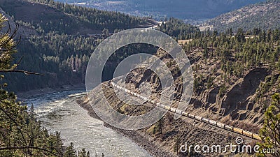 Trains Laboring through the Fraser Canyon in Britsh Columbia Stock Photo