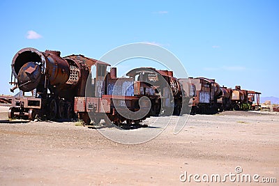 Trains in ruins abandoned in the middle of the desert. Cemetery of trains in Bolivia. Stock Photo