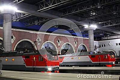 Trains at the train station waiting for passengers to board. Travel by rail on vacation Editorial Stock Photo