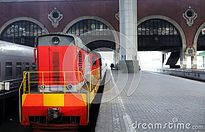 Trains at the train station waiting for passengers to board. Travel by rail on vacation Editorial Stock Photo