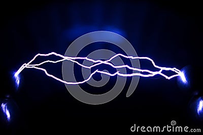 The trajectory of a spark electric discharge. Artificially created spark discharges Stock Photo