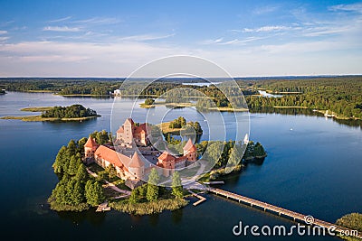 Trakai Castle with lake and forest in background. Lithuania Stock Photo