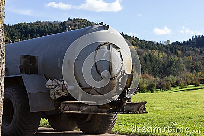 traktor bringing out liquid manure Stock Photo