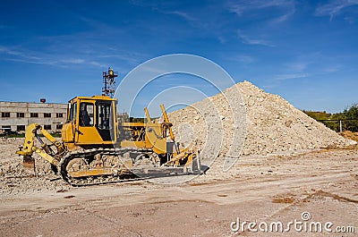 Traktor on the mine of white clay Stock Photo