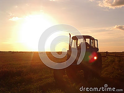 Traktor in sunset Stock Photo