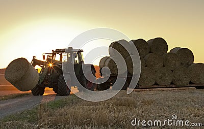 Traktor at work on a field Stock Photo