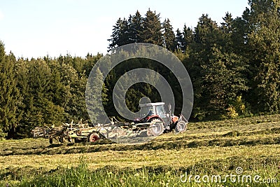 Traktor at work on a field Stock Photo