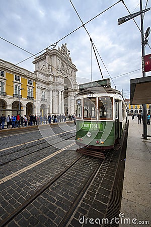 Tram in the Comercio Square Praca do Comercio with the Augusta Street Arch on the background, in the city of Lisbon Editorial Stock Photo