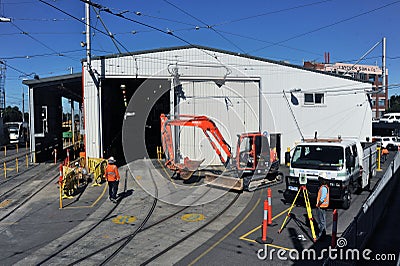 Tram depot during an upgrade with workers onsite Editorial Stock Photo
