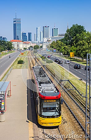 Tram in front of skyscrapers in Warsaw Editorial Stock Photo