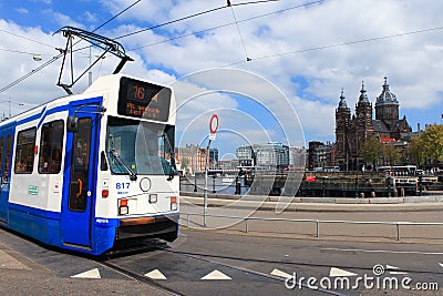 Tram (Local light rail transportation) heading to Amsterdam central station Editorial Stock Photo