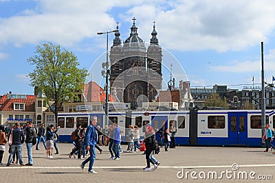 Tram (Local light rail transportation) heading to Amsterdam central station Editorial Stock Photo