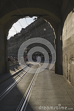 Tram railway tunnel under the baroque tower Kafigturm on a historical cobbled street. Editorial Stock Photo