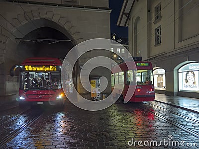 Tram rushes at night in front of the historic Zytglogge (clock tower) in Bern Editorial Stock Photo