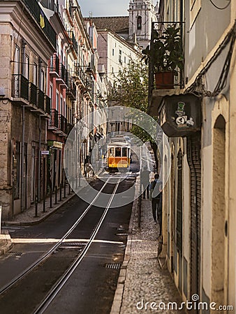 Tram Tales - Lisbon's Historic Tram 28 Weaving Through Narrow Streets Editorial Stock Photo