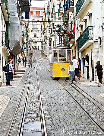 Tram in an uphill street in Lisbon, Portugal Editorial Stock Photo