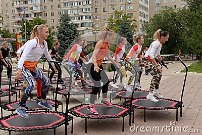 Trampoline training on the street. Orenburg, Russia, 02.08.19. sports performances, jumps. Outdoor fitness training. Editorial Stock Photo