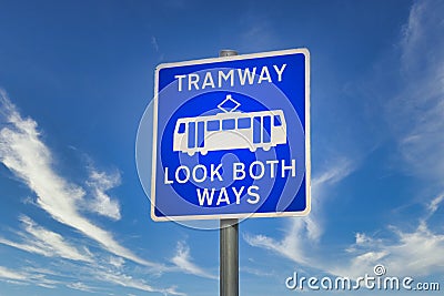 Tramway safety blue sign look both ways Stock Photo