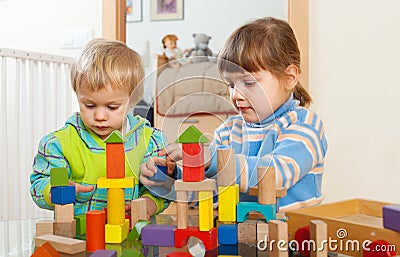 Tranquil children playing with wooden toys Stock Photo