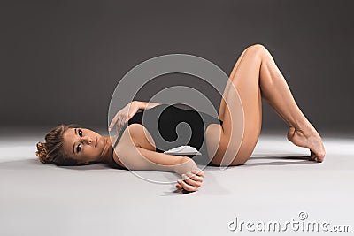 Beautiful fit woman reposing on the floor Stock Photo