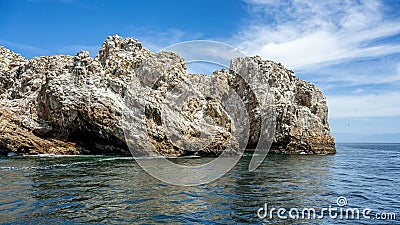Tranquil island with crystal clear blue waters, set against a stunning backdrop of the sky in Mexico Stock Photo