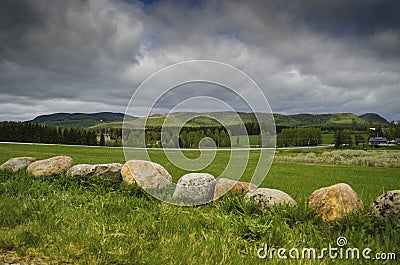 Tranquil nature landscape view with green grass mountain and blue sky covered with clouds in a beautiful day Stock Photo