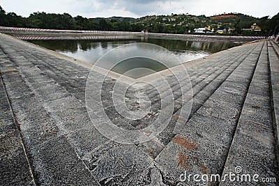 tranquil reflections: skanda pushkarini temple tank embraced by nature's beauty