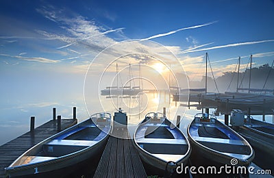 Tranquil sunrise at marina Stock Photo