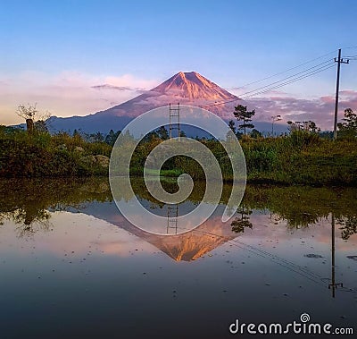 Tranquil Sunrise over Mountain Lake Stock Photo