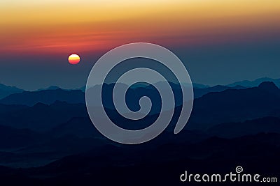 Tranquil Sunrise over Sinai Mountain Range from the Top of Mt. Sinai Stock Photo