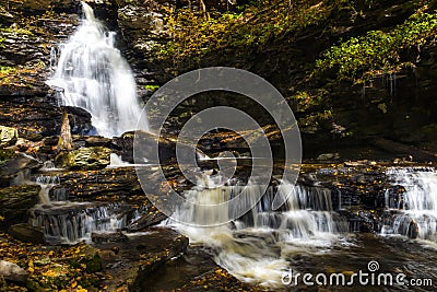 tranquil waterfall in Pennsylvania forest during autumn Stock Photo