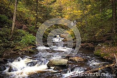 tranquil waterfall in Pennsylvania forest during autumn Stock Photo