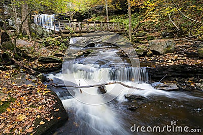 tranquil waterfall in Pennsylvania forest during autumn Stock Photo