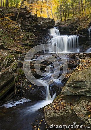 tranquil waterfall in Pennsylvania forest during autumn Stock Photo