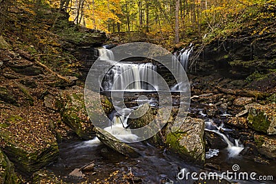 tranquil waterfall in Pennsylvania forest during autumn Stock Photo