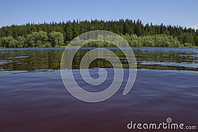 Tranquil waters of a wide slow river Stock Photo